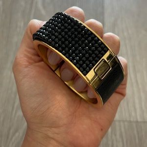 Swarovski “Intervalle” wide leather and gold-filled bangle